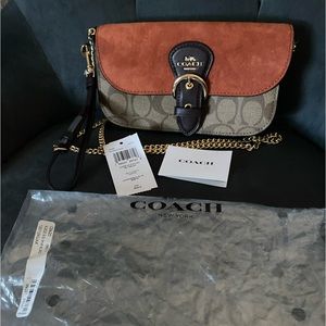 Super cute Coach crossbody never used. 7.5” x 4”